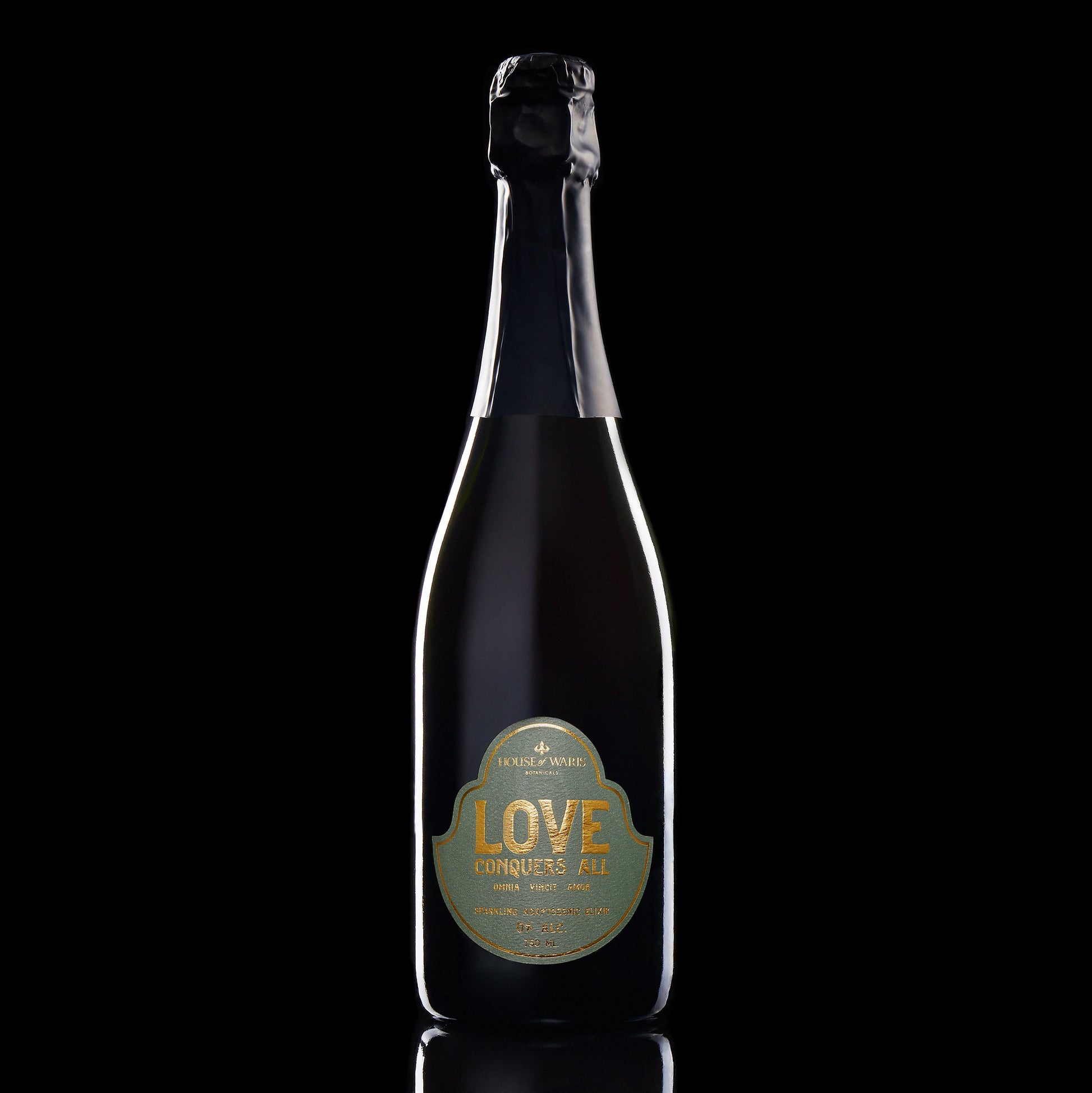 Bottle of 'LOVE' champagne with a gold label on a black background